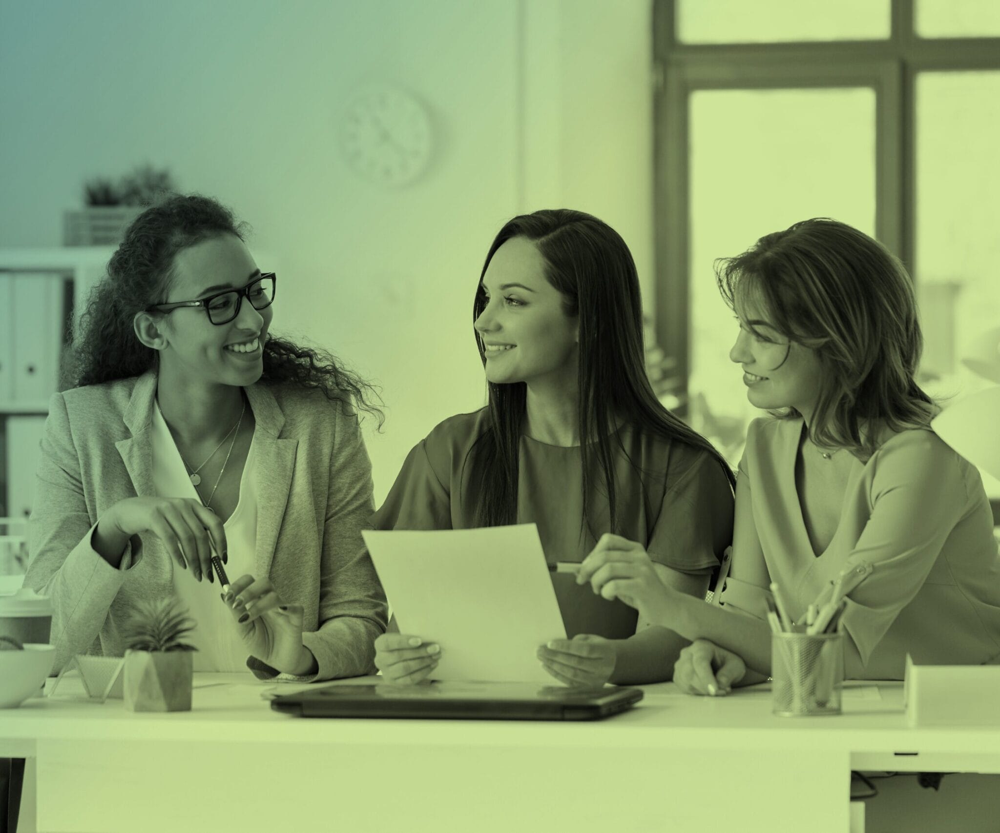 A group of people looking at a document.