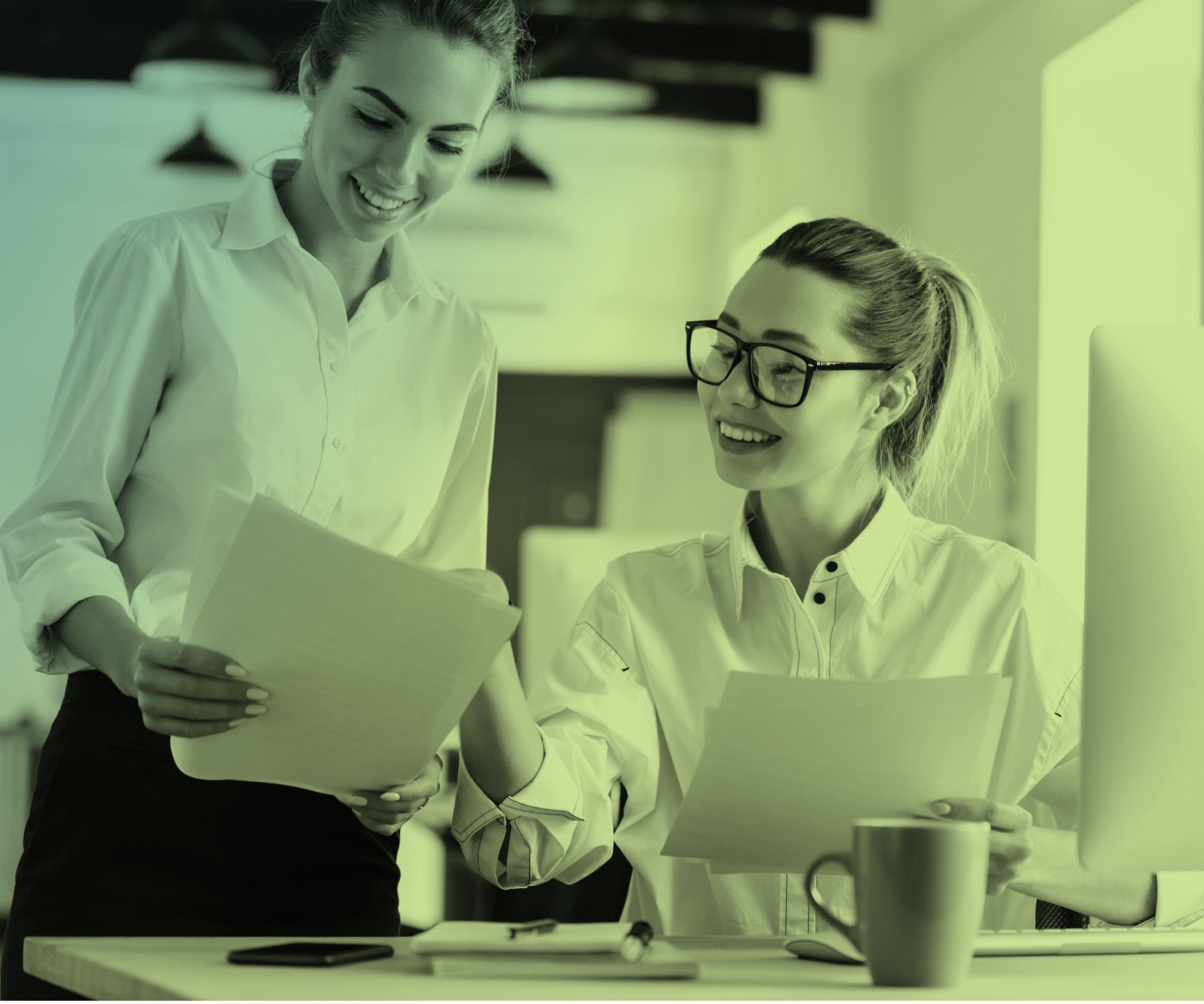 Two people looking at papers.